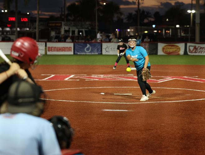 A DIV Ferrell lets go behind backstop.jpg