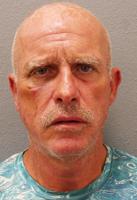 Local man accused of spitting on deputy