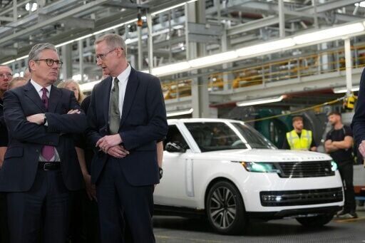 American carmakers blasted a US-UK auto trade deal, saying it gives a leg up to British cars, such as those made at the Jaguar Land Rover car factory in England where CEO Adrian Mardell (R) recently hosted Britain's Prime Minister Keir Starmer (L)