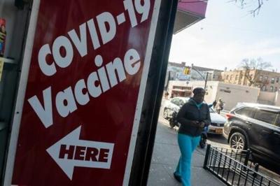A pharmacy advertises the COVID-19 vaccine as the nation marks the fifth anniversary of the Covid-19 pandemic on March 13, 2025 in New York City