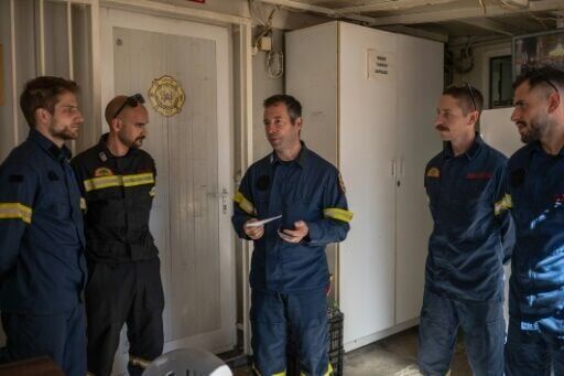 Apollos Kounis, centre, says protecting the mountain forests is his 'life'