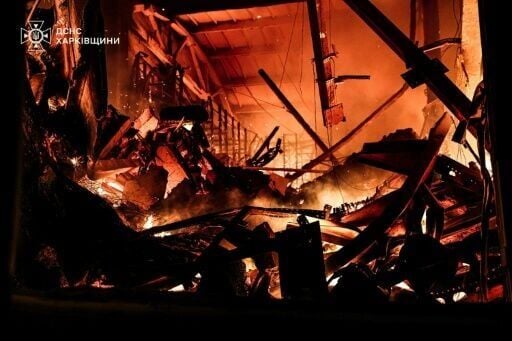 Handout by Ukrainian State Emergency Service Press Service on May 26, 2025 shows a blaze in a private enterprise facility following a Russian strike in Kharkiv region